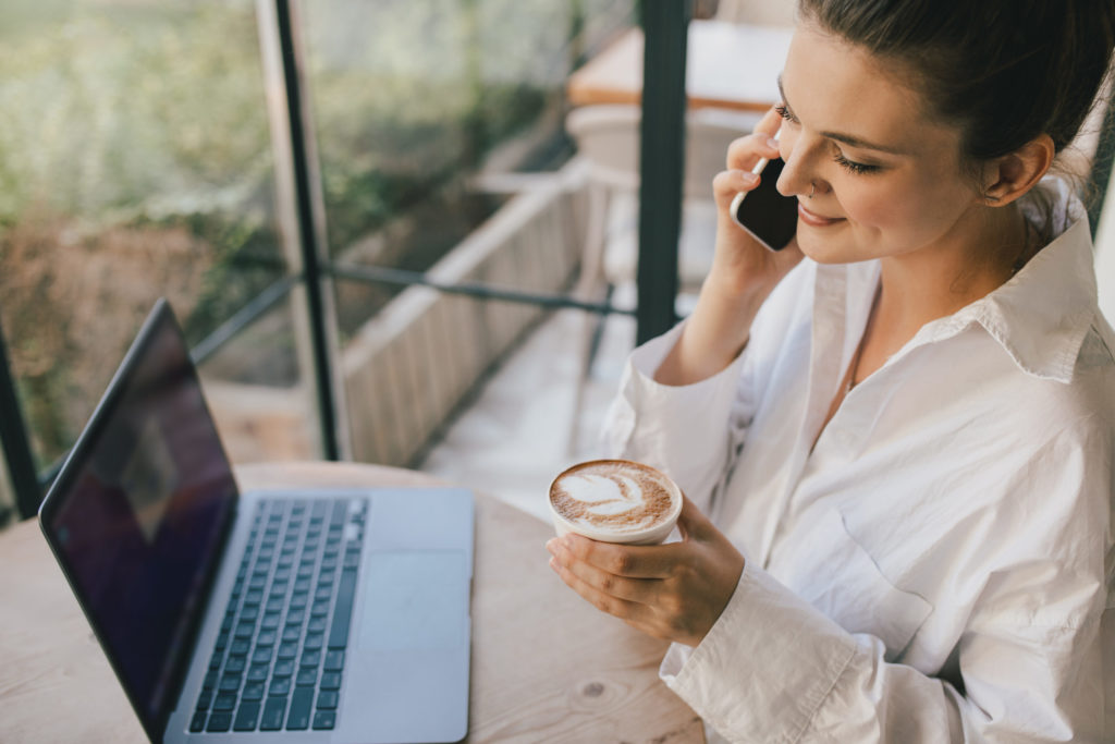 young woman drinking coffee working online using h 2022 11 04 03 15 47 utc scaled